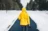 person on yellow jacket standing between snow floors